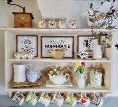 a shelf with coffee cups and mugs on it